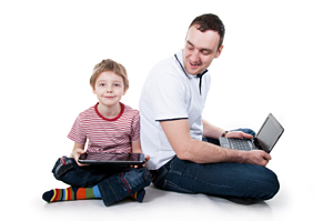 Dad and son with laptop and tablet
